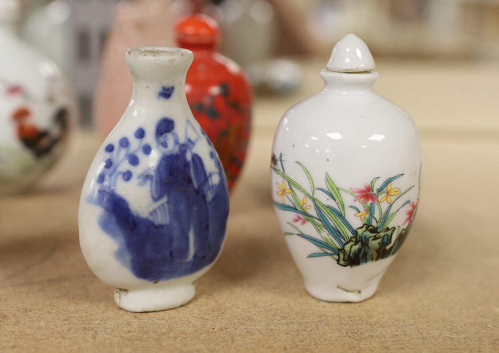 A collection of Oriental and Chinese items including quartz and hand painted snuff bottles, the largest 14cm in length